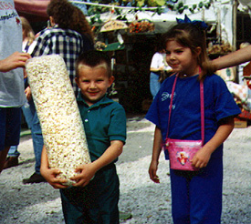 [kids with popcorn bags]